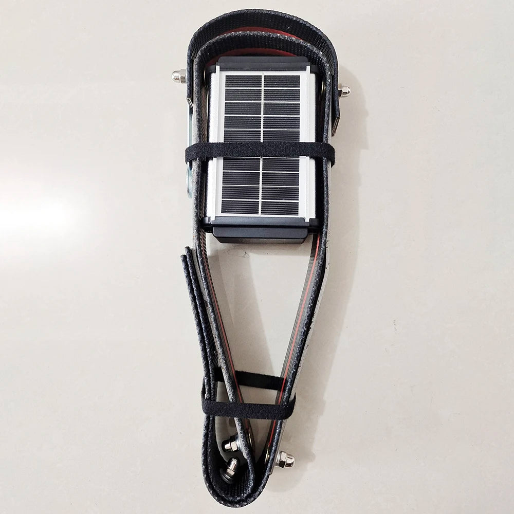 Manewise GPS tracker solar panel fitted into black strap harness