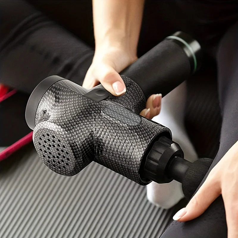 Manewise recovery massager in carbon-fiber finish, in use on person's leg